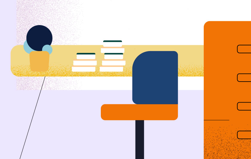 desk with stacked books on top and filling drawers on the side