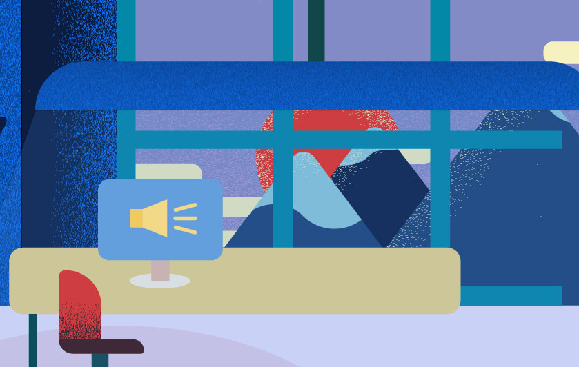 desk with a computer that shows an announcement icon