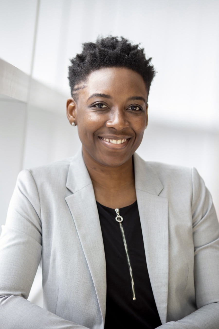 Woman wearing gray notch lapel suit jacket