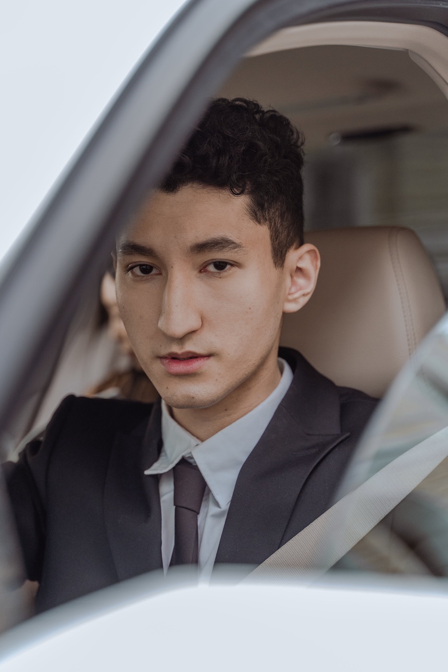 Young asian man in black suit jacket