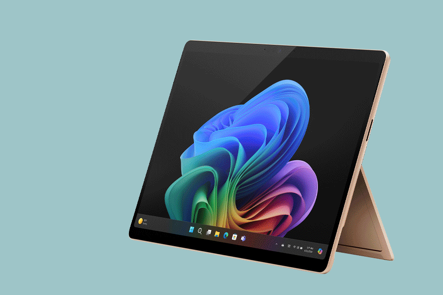 An assortment of AI laptops shown on various brightly-coloured backgrounds.