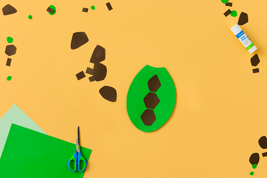 A series of images showing how to create a paper turtle (gurlibil) for NAIDOC Week. This example uses green and brown construction paper, scissors and glue.