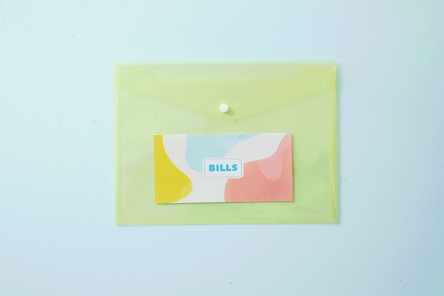 A series of images showing how to create cabinet door pockets for different kinds of paperwork. This example uses an assortment of coloured document wallets and custom printed cards as labels.