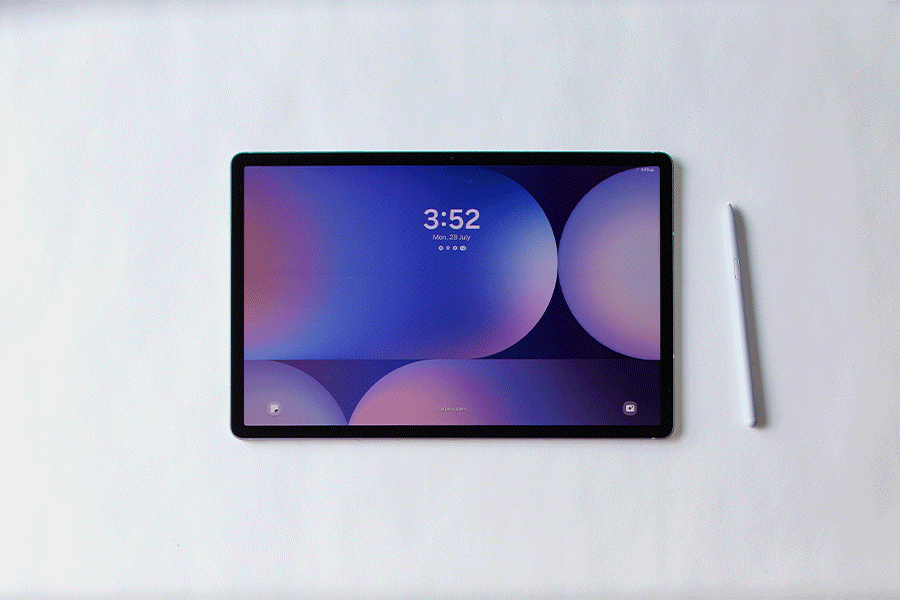 A series of images showing a hand interacting with a Samsung Galaxy S10 tablet using a stylus, opening the home screen that features various apps and a search bar, all shown against a white surface.