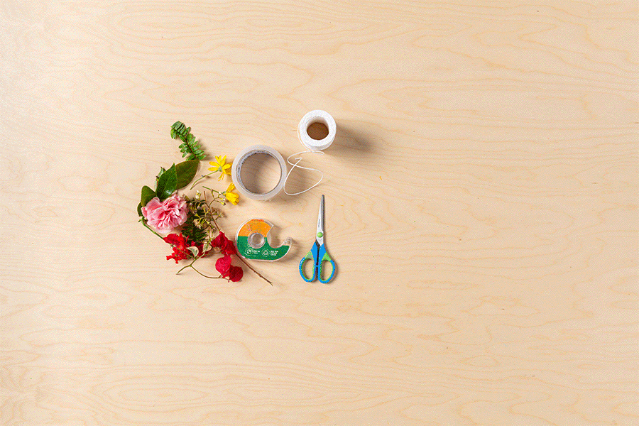 A series of images showing the process of creating a nature bracelet using packing tape placed around a wrist, then once filled with flowers and leaves, taped over and tied together.