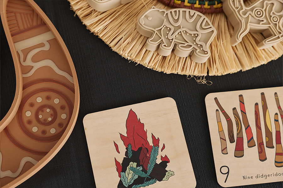 Riley Callie Resources, including stamps and cards, arranged together on a table on top of a black tablecloth.