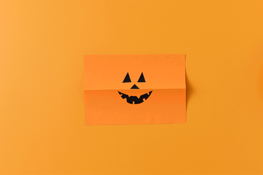 A series of images showing how to make a paper pumpkin lantern for a Halloween craft project for kids. 