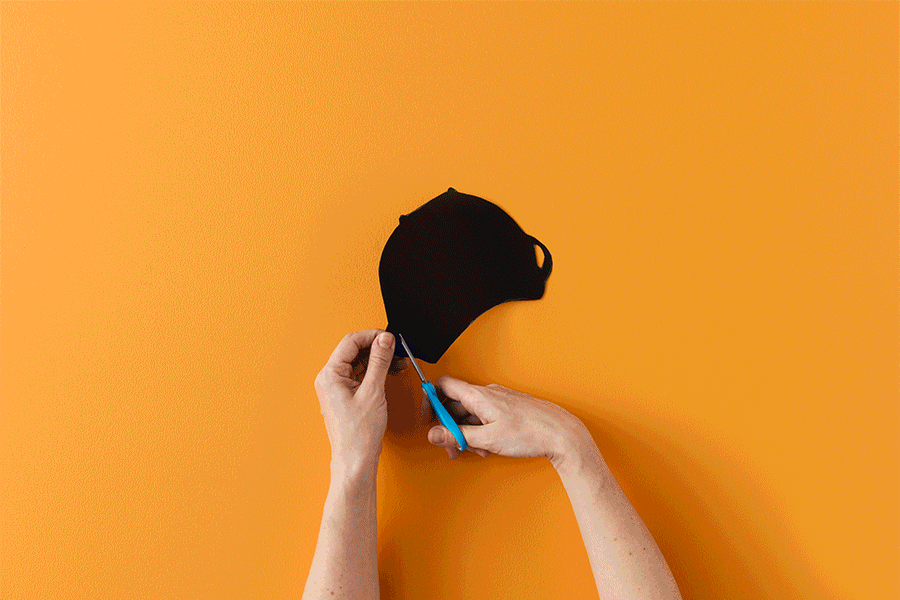 A series of images showing how to make a pop-up magic cauldron for a Halloween craft project for kids.