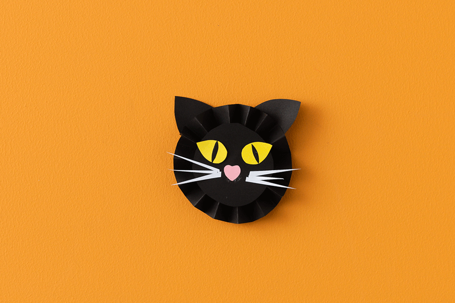 A series of images showing how to make a paper fan black cat for a Halloween craft project for kids.