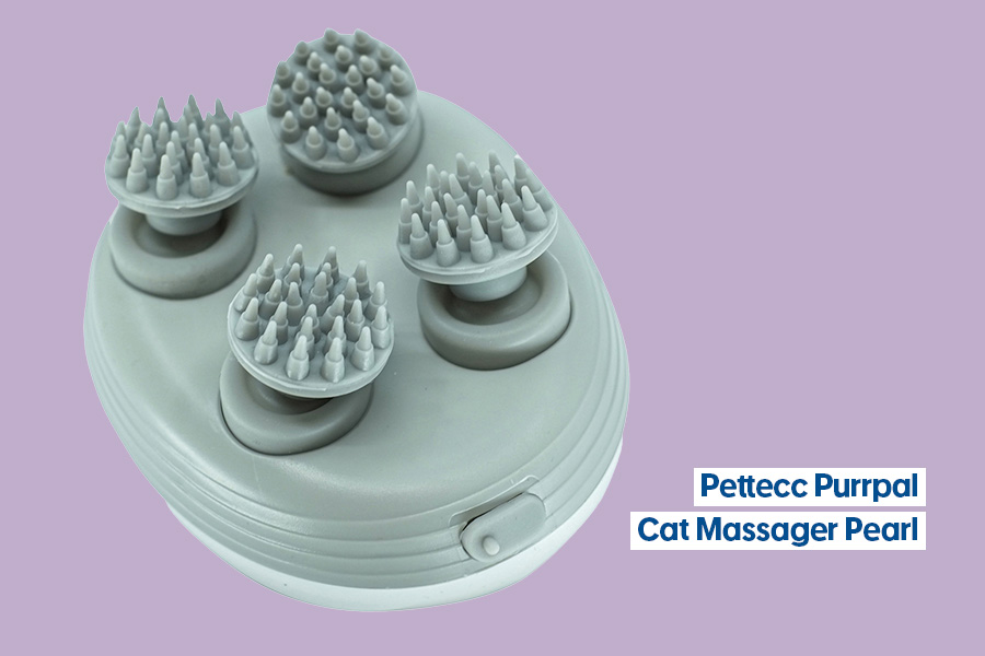 A Pettecc Purrpal Cat Massager Pearl in grey, featuring four rotating massage heads with soft spikes, displayed against a purple background.