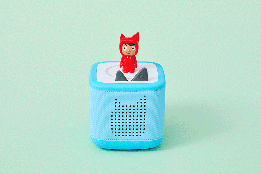 A selection of Christmas gifts for preschoolers, shown on various brightly coloured backgrounds. Products include things like wooden toys and a screen-free audio system.