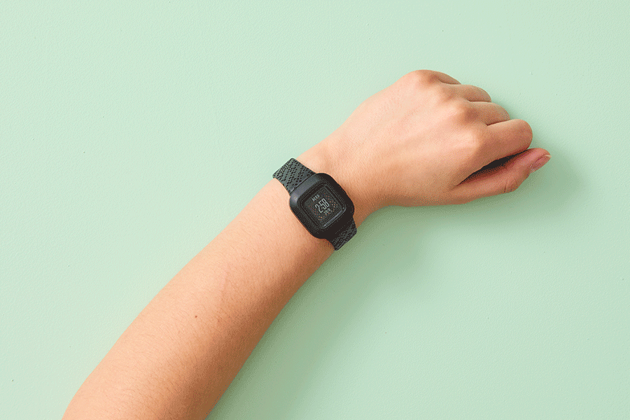 A selection of tech Christmas gifts for kids, shown on various brightly coloured backgrounds. Products include an activity tracker and wireless headphones.