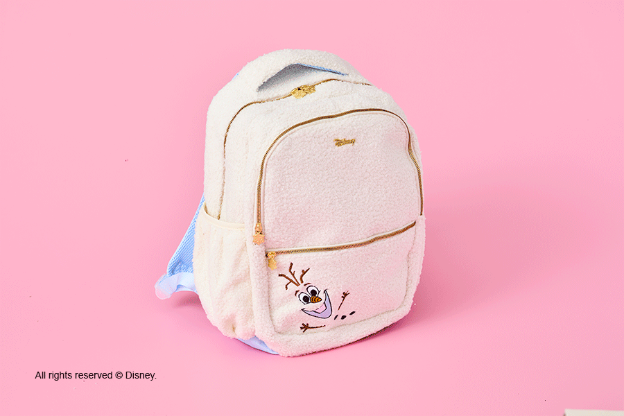 A selection of Disney’s Frozen-themed Christmas gifts for kids, shown on a pink background. Products include a white and gold backpack and coin purse featuring the character Olaf.
