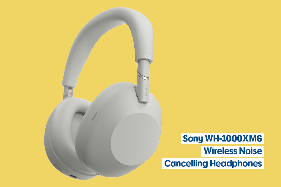 Sony WH-1000XM6 wireless over-ear headphones in silver, shown against a yellow background.