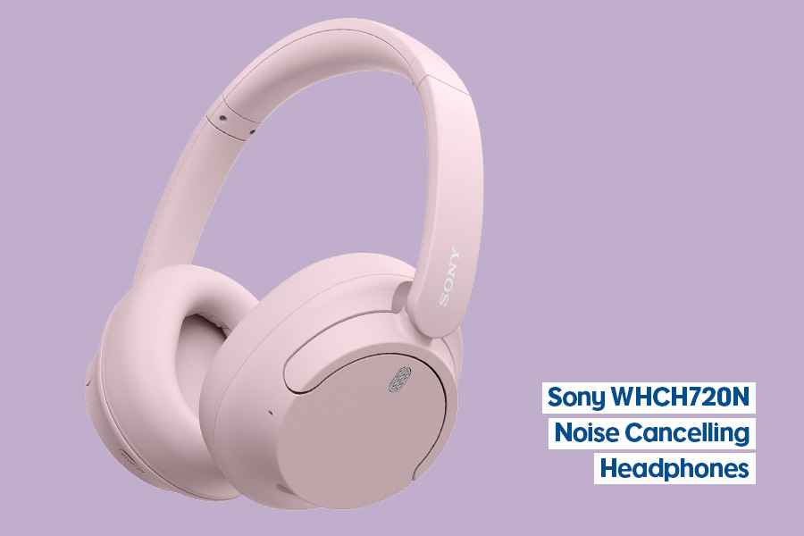 A pair of Sony WHCH720N over-ear headphones in pale pink, shown against a lilac background.
