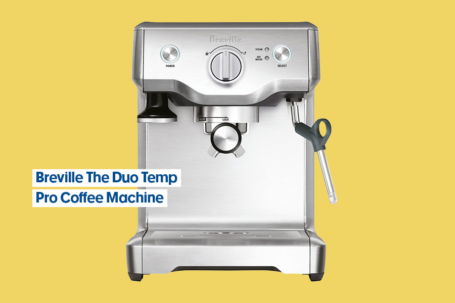 A Breville The Duo Temp Pro stainless steel coffee machine shown against a yellow background.