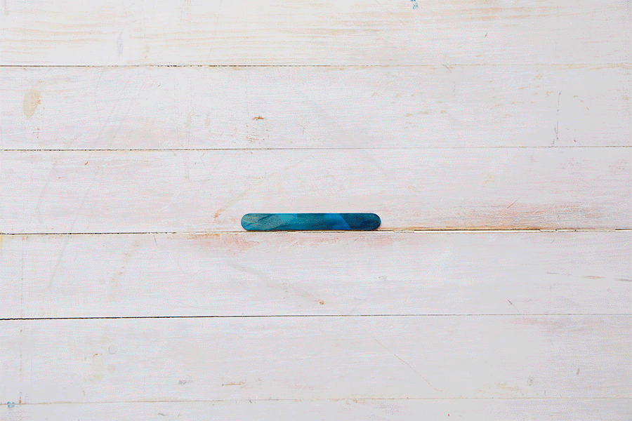 A series of images demonstrating Step 2 of making a craft stick bridge, showing the construction of the U-shaped support piece with an added horizontal stick for height.