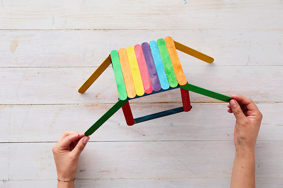 A series of images demonstrating Step 4 of making a craft stick bridge, showing the final two flat sections being glued into place as the ramps.