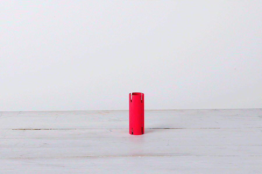 A series of images demonstrating Step 5 of making cardboard roll stackers, showing the finished, colourful cardboard rolls being stacked on top of each other to create a structure.