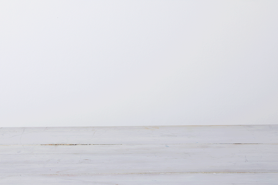 A series of images showing the completed recycled box builders being stacked on top of each other.