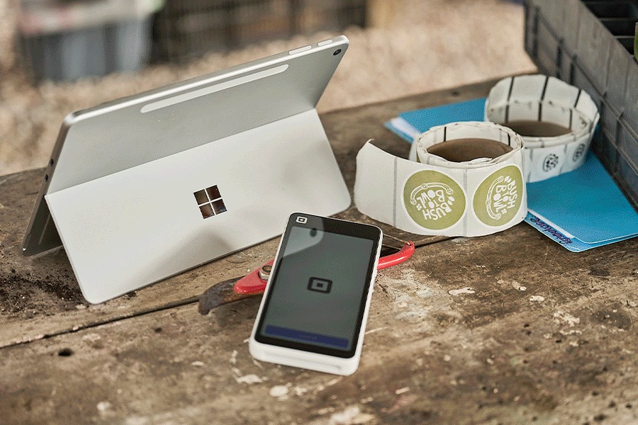  A series of images showing an assortment of small business supplies. Products include a Square POS system in use, a Brother label printer, POSCA markers, extension cables and more.