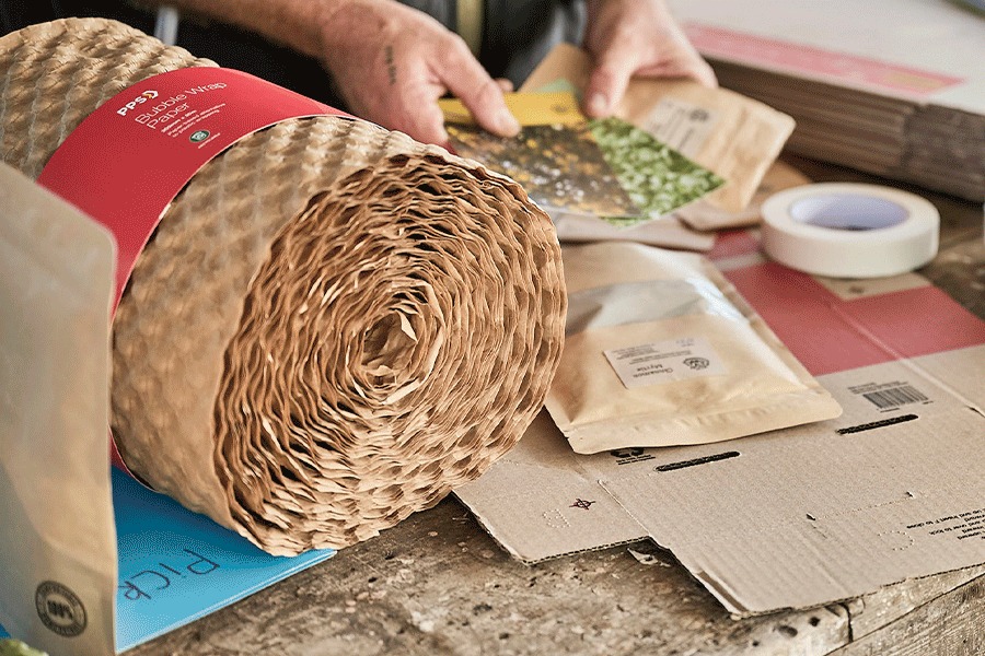 A series of images showing an assortment of packaging supplies. Products, including mailing boxes, bubble paper and masking tape, are shown in use.