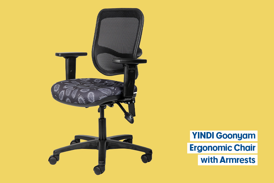 The YINDI Goonyam office chair with adjustable armrests, black mesh back and patterned fabric seat on a black base and castors, shown on a yellow background.