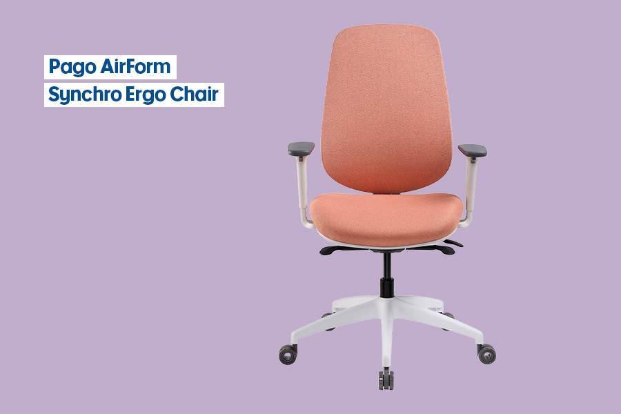 The Pago AirForm Synchro Ergo office chair in ‘Peach Orange’, with a peach-coloured seat and back, adjustable grey armrests and a white base on castors, shown against a purple background.