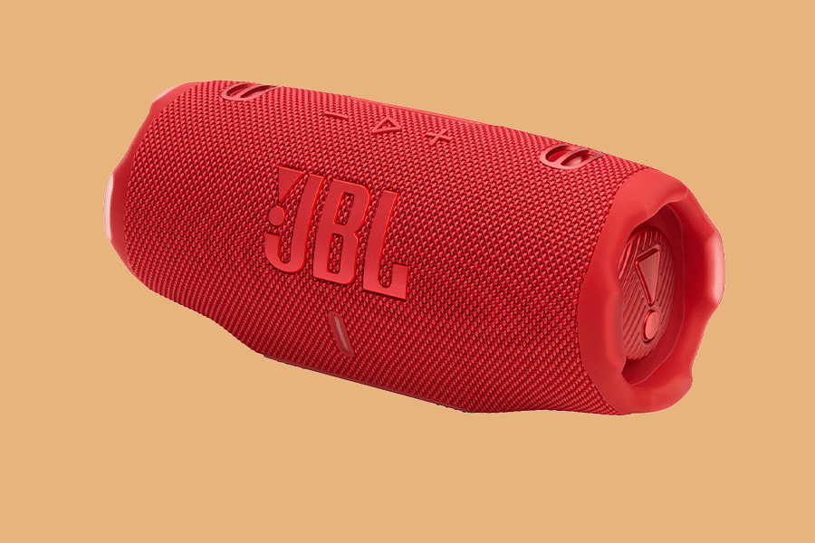 An assortment of speakers shown on various brightly coloured backgrounds. Products include the JBL Charge 6 Bluetooth Speaker in red, and Logitech Multimedia Speakers in black.