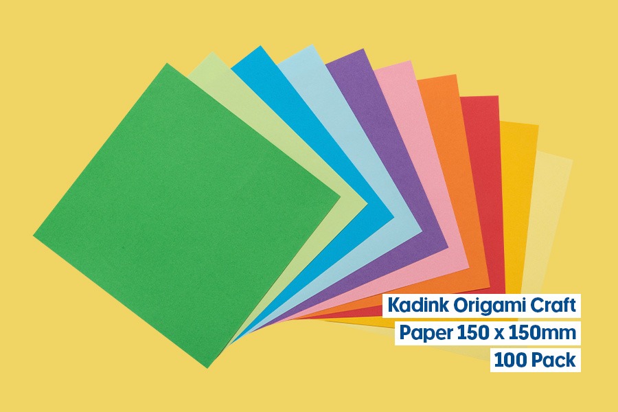 Kadink origami craft paper, 150 x 150mm, 100-pack in assorted bright colours, fanned out on a yellow background.