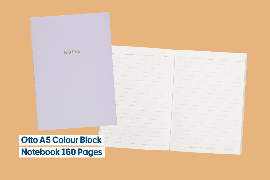 Otto A5 Colour Block Notebook, shown closed in lilac with gold ‘Notes’ text and open to lined pages, shown against an orange background.