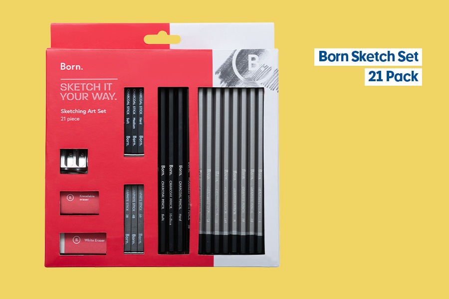 Born Sketch Set with pencils, graphite sticks, sharpeners and erasers, shown against a yellow background.