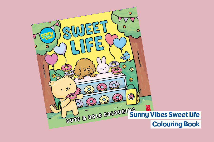 Sunny Vibes Sweet Life colouring book cover with cute animals, balloons and a doughnut stand in a park scene, displayed on a pink background.