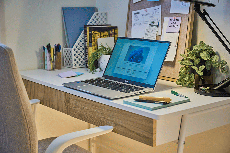 A rotating series of images featuring compact and ergonomic home office furniture and tech for small spaces, such as slimline desks and chairs and laptops.