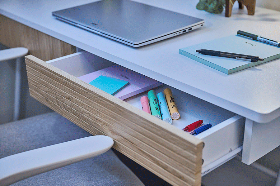 A rotating series of images showcasing storage solutions for small spaces, including floating shelves, pin boards and desk drawers.