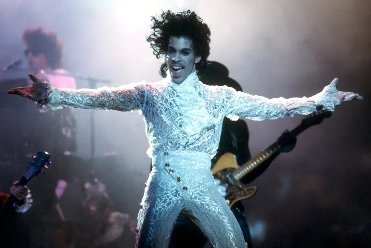 Michael Ochs Archives/Getty Images. Prince sported a white lace two-piece outfit while letting loose in performance at California's Fabulous Forum on Feb. 19, 1985.