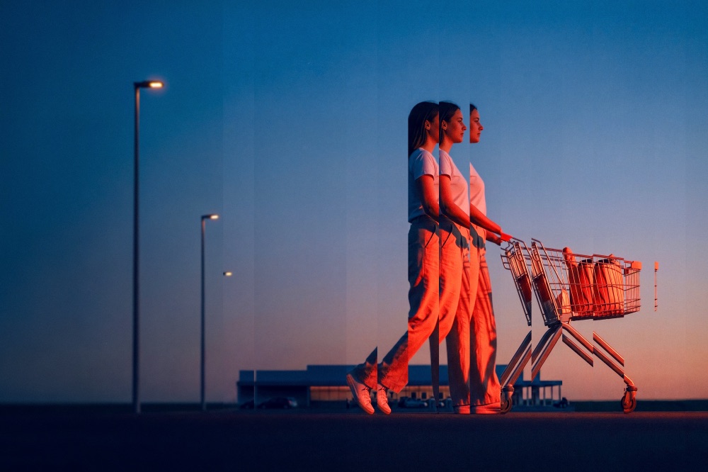 A shopper with a trolley at dusk, repeated in vertical slices
