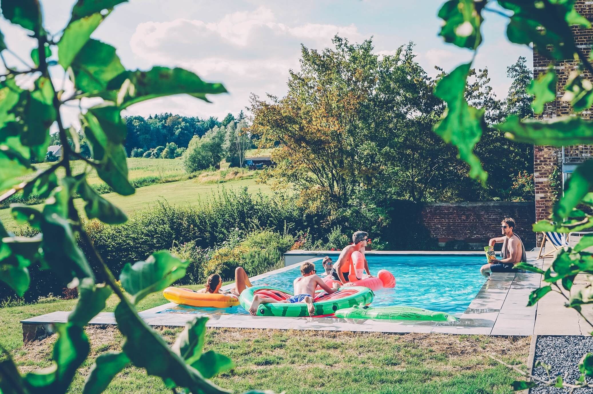 Graduates relaxing in the pool