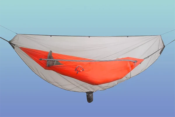 A mosquito net around a hammock.