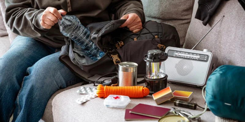 Emergency gear on a couch.
