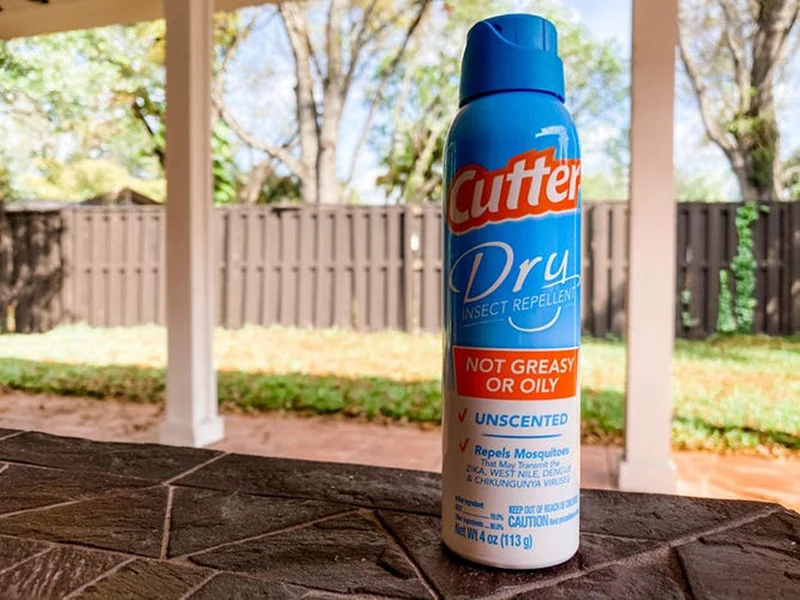 A bottle of insect repellent on a table.