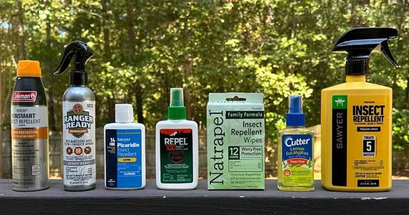 Bottles of insect repellent on a table.