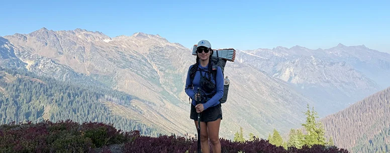 A person standing on a mountain.