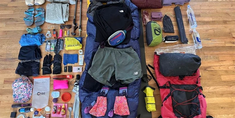 Hiking gear on the ground.