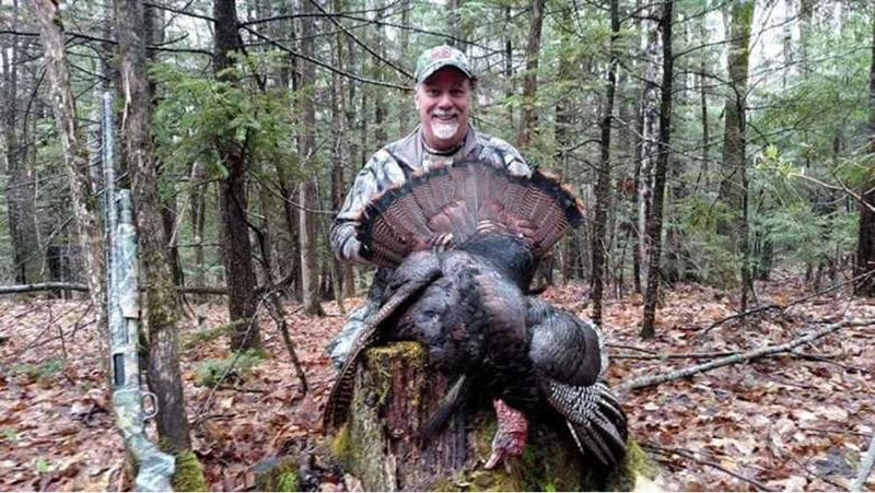 A man with a turkey.