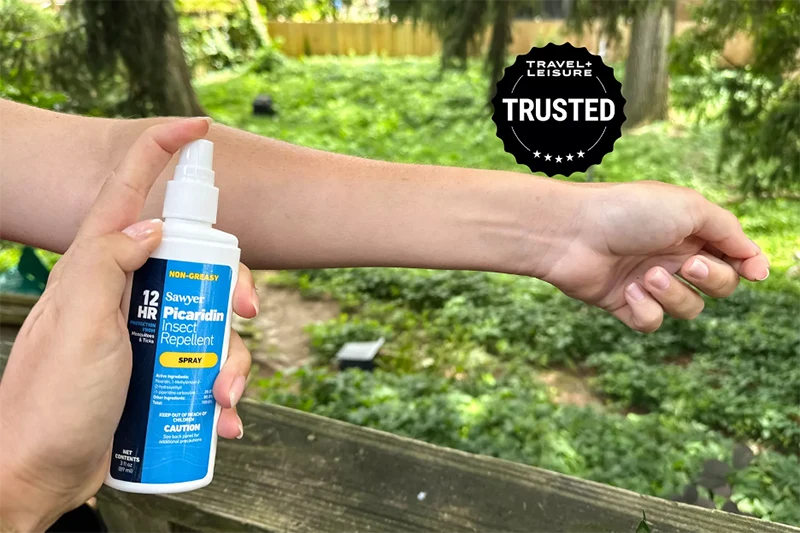 Sawyer Picaridin being sprayed on an arm.