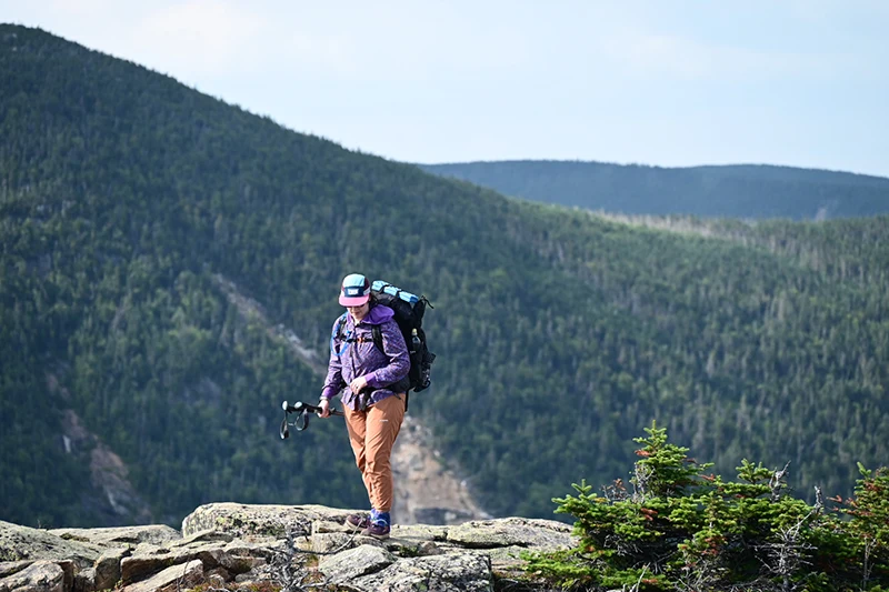 A hiker on a cliff.