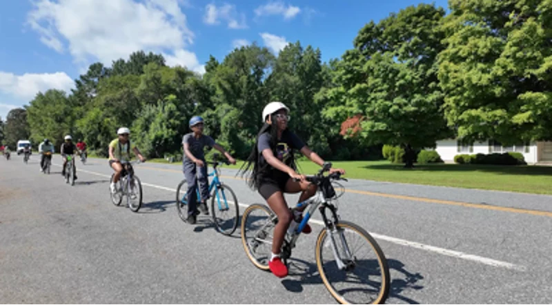 A group of people on bikes.