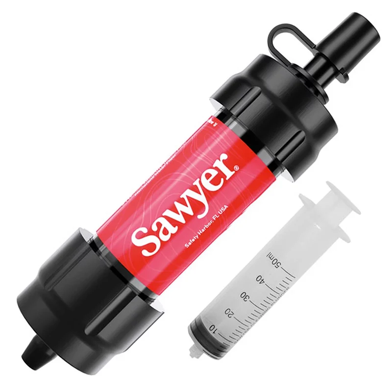 Sawyer water filter with a red label and a black cap, accompanied by a clear plastic syringe with measurement markings up to 50 ml.