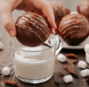 a chocolate cakes and a cup with a cream